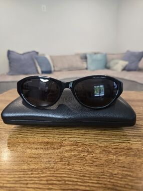 Balenciaga Women’s Black Curved Frame Sunglasses